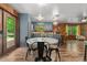 Open kitchen and eat-in area features modern appliances and hardwood floors at 515 Tramway West Rd, Sanford, NC 27330