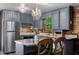 Kitchen with granite countertops, stainless steel appliances, and decorative chandelier at 515 Tramway West Rd, Sanford, NC 27330