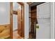 Convenient laundry room with washer and dryer, closet, and wood paneling at 515 Tramway West Rd, Sanford, NC 27330
