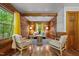 Cozy living room with wood paneled walls, hardwood floors, and lots of natural light at 515 Tramway West Rd, Sanford, NC 27330