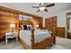 Comfortable bedroom with wood paneling and a closet with sliding doors at 515 Tramway West Rd, Sanford, NC 27330