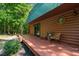 Charming log cabin showcasing a cozy patio with outdoor seating at 515 Tramway West Rd, Sanford, NC 27330