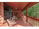 Charming log cabin porch with seating, offering a relaxing outdoor space at 515 Tramway West Rd, Sanford, NC 27330