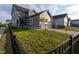 Backyard featuring a black metal fence and detached garage at 5200 Beckom St, Raleigh, NC 27616
