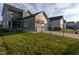 Side and rear view of house highlighting screened porch and rear garage at 5200 Beckom St, Raleigh, NC 27616