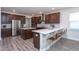 Spacious kitchen with stainless steel appliances, an eat-in island, and a stylish backsplash at 5200 Beckom St, Raleigh, NC 27616