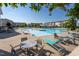 Community pool with ample seating, clear blue water, and a serene atmosphere for relaxation and recreation at 5200 Beckom St, Raleigh, NC 27616