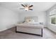 Bedroom featuring a ceiling fan, plush carpet, neutral wall color, and comfortable furnishings at 521 Marion Hills Way, Knightdale, NC 27545