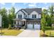 Charming two-story home with stone accents, a covered porch, and a well-manicured lawn at 521 Marion Hills Way, Knightdale, NC 27545