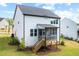 Rear exterior view of home featuring a screened porch with steps to the yard at 521 Marion Hills Way, Knightdale, NC 27545