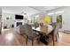 Open-concept living space showcases a fireplace, comfortable seating, and dining area with backyard views at 521 Marion Hills Way, Knightdale, NC 27545