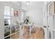 Well-lit home office with a glass-top desk, a white chair, and ample workspace at 521 Marion Hills Way, Knightdale, NC 27545