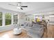 Open-concept living space with comfortable seating flowing to dining and a modern, bright kitchen at 521 Marion Hills Way, Knightdale, NC 27545