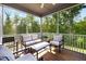 Relaxing screened porch with comfortable seating and wooded views at 521 Marion Hills Way, Knightdale, NC 27545