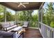 Relaxing screened porch with comfortable seating and ceiling fan at 521 Marion Hills Way, Knightdale, NC 27545