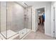 Modern bathroom shower with glass enclosure, seating and adjacent walk-in closet at 521 Marion Hills Way, Knightdale, NC 27545