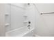 Shower over tub with three shelves and a chrome shower head at 521 Marion Hills Way, Knightdale, NC 27545