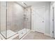 Modern bathroom shower with glass enclosure and built-in bench seating at 521 Marion Hills Way, Knightdale, NC 27545