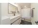 A stylish bathroom featuring a modern shower, new fixtures, and black and white tile at 529 Orindo Dr, Durham, NC 27713