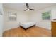 This bright bedroom features hardwood floors, neutral walls, and a modern ceiling fan at 529 Orindo Dr, Durham, NC 27713