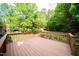 Large wooden deck overlooking a spacious backyard with lush greenery at 529 Orindo Dr, Durham, NC 27713
