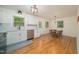 Bright dining area with hardwood floors, white cabinets and stainless steel appliances at 529 Orindo Dr, Durham, NC 27713