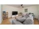 Spacious living room with a comfortable gray sectional, perfect for relaxing and entertaining at 529 Orindo Dr, Durham, NC 27713