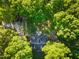 Aerial view of a wooded lot featuring a home, driveway and room for parking at 54 Malcolm Neal Path, Louisburg, NC 27549