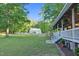 Spacious backyard and detached garage, visible from the covered porch with steps at 54 Malcolm Neal Path, Louisburg, NC 27549