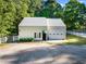 Aerial view of horse barn featuring an overhead garage door and grassy lot at 54 Malcolm Neal Path, Louisburg, NC 27549