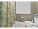 Bathroom with a shower, toilet and a bright window at 54 Malcolm Neal Path, Louisburg, NC 27549