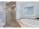 Relaxing bathroom with a soaking tub and separate shower at 54 Malcolm Neal Path, Louisburg, NC 27549