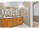 Bathroom with a double sink vanity, neutral walls and tile floor at 54 Malcolm Neal Path, Louisburg, NC 27549