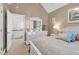 Bright bedroom features a vaulted ceiling, large dresser, and a view of the upstairs hallway at 54 Malcolm Neal Path, Louisburg, NC 27549