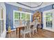 Charming dining area with farmhouse table, upholstered chairs, and natural light at 54 Malcolm Neal Path, Louisburg, NC 27549