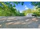 Equestrian area with a stable in the background and green trees at 54 Malcolm Neal Path, Louisburg, NC 27549