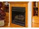 Close-up on a wood burning fireplace with intricate wood trim and decorative carvings at 54 Malcolm Neal Path, Louisburg, NC 27549