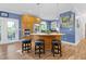 Stylish kitchen island with barstool seating and modern stainless steel appliances at 54 Malcolm Neal Path, Louisburg, NC 27549