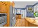 Well-equipped kitchen featuring stainless steel appliances and blue-painted walls at 54 Malcolm Neal Path, Louisburg, NC 27549