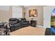 Comfortable living room featuring reclining seating, neutral walls and a bright window at 54 Malcolm Neal Path, Louisburg, NC 27549
