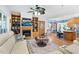 Open-concept living room featuring a fireplace, built-in shelves and adjacent dining area with bright decor at 54 Malcolm Neal Path, Louisburg, NC 27549