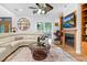 Cozy living room with cream sectional, fireplace, and decorative accents for comfortable relaxation at 54 Malcolm Neal Path, Louisburg, NC 27549