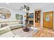 Comfortable living room with a fireplace, custom built-ins, hardwood floors, and plenty of natural light at 54 Malcolm Neal Path, Louisburg, NC 27549