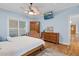 Cozy bedroom with ceiling fan, television, and natural light at 54 Malcolm Neal Path, Louisburg, NC 27549