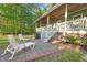 Relaxing patio area with lounge chairs, accessible from the porch steps at 54 Malcolm Neal Path, Louisburg, NC 27549