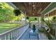Relaxing porch with comfortable seating, decorative plants, and a view of the yard at 54 Malcolm Neal Path, Louisburg, NC 27549