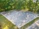 Aerial view of a riding arena with fencing in a wooded area at 54 Malcolm Neal Path, Louisburg, NC 27549