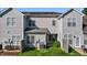 View of townhome backyard, fence, and green space with AC unit and patio access at 604 Oakfield Trl, Mebane, NC 27302