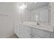 Bathroom featuring a double vanity with ample storage and a large mirror at 604 Oakfield Trl, Mebane, NC 27302