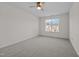 A bright bedroom featuring neutral carpeting and a ceiling fan at 604 Oakfield Trl, Mebane, NC 27302